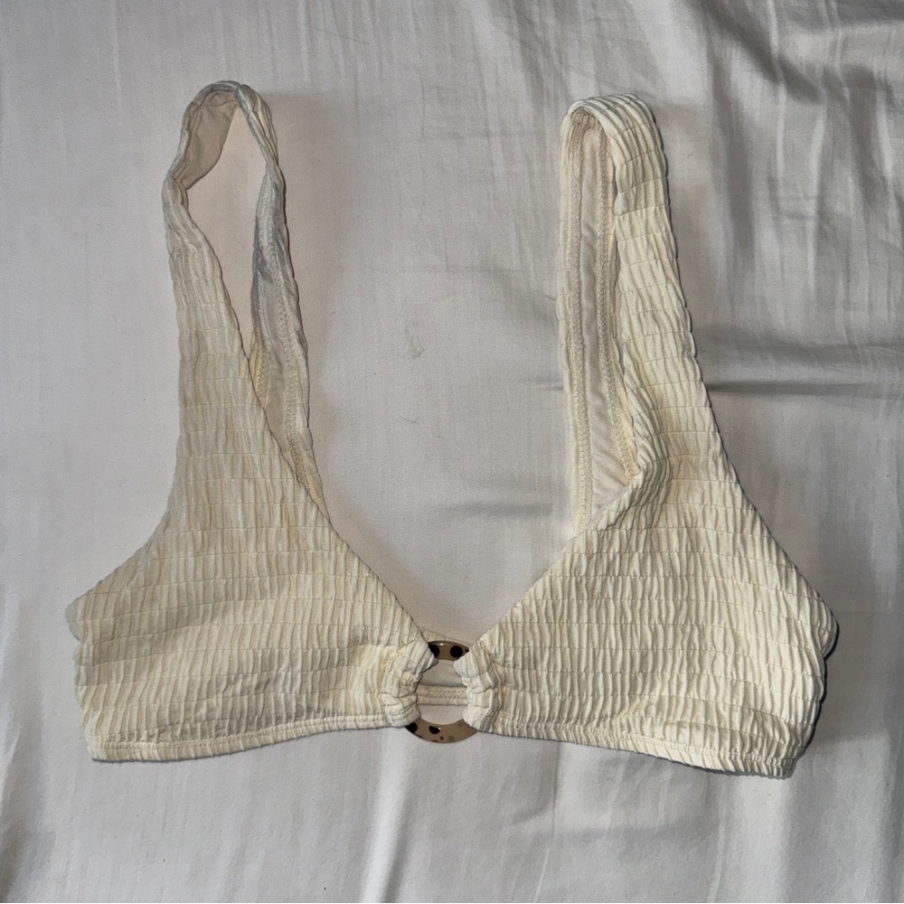 Beige bikini top with tortoise shell ring detail